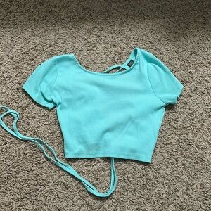 teal cropped top with open back